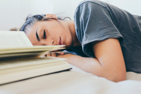 Woman Asleep Near Book