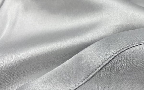Close up of silk charmeuse sheets