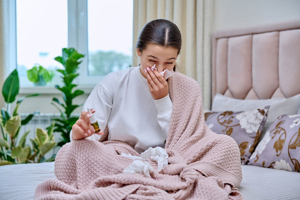 Woman Sneezes in Bed