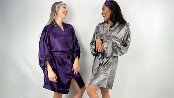 Women Weaing Gunmetal and plum silk robes and coordinating glam bands