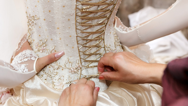 tieing a bodysuit corset