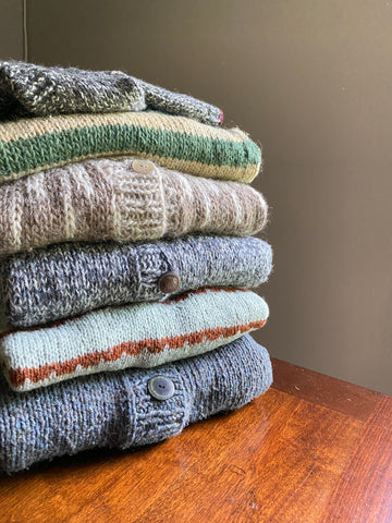 Stack of Sweaters made with TWT yarns