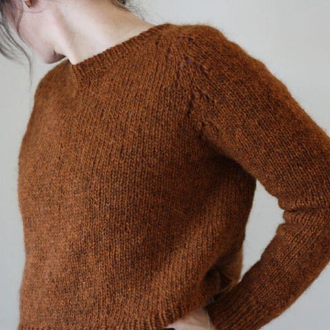 Model wears a rust colored Felix pullover