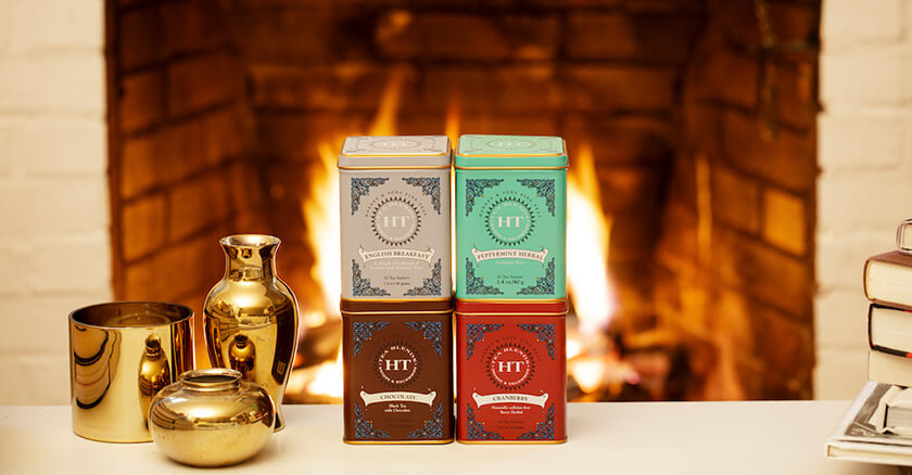 tea tins in front of fireplace