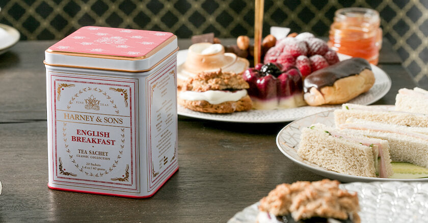 pink tea tin with treats on a table