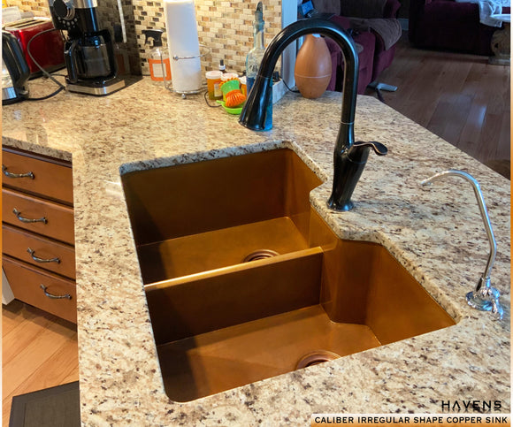 custom copper sink with a lowered divider, 14 gauge pure copper and segmented 