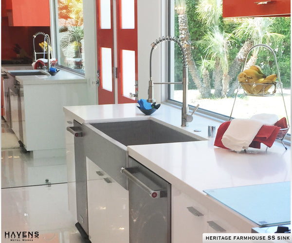 Stainless steel textured sink in a kitchen with a farmhouse apron front