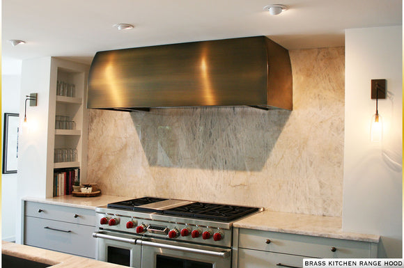 Brass kithcen range hood custom made in the USA by Havens Metal. Fully equipped ventilation system and liner blower.