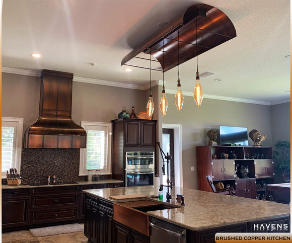 Rustic modern kitchen with luxury brushed copper details in the hood, sink, and lighting