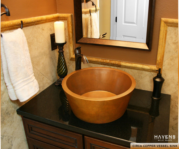 Custom made copper vessel sink handcrafted in America with a oil rubbed bronze faucet.