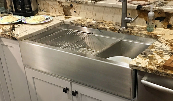 Farmhouse stainless steel sink installed in a kitchen, courtesy of Havens.