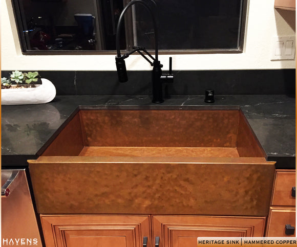 hammered copper farm sink with a beautiful apron front, custom made of 14 gauge copper