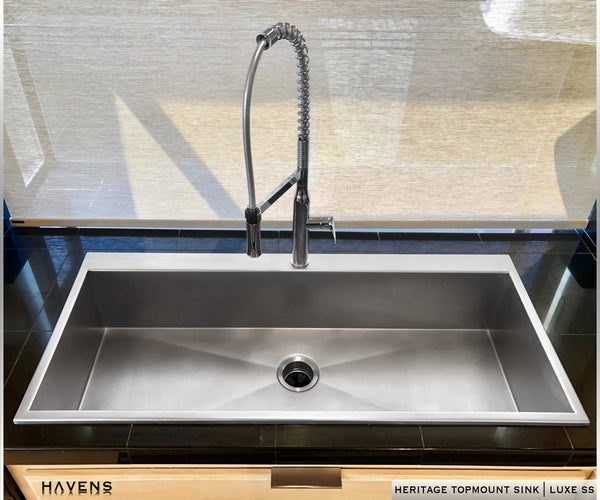 Top mount custom sink with rear deck for faucet