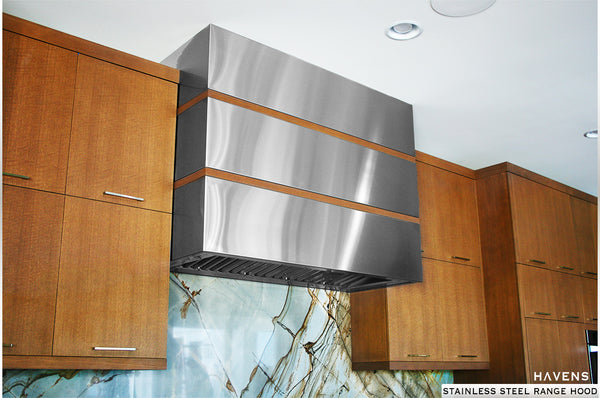 Stainless steel range hood installed in high end residential kitchen.