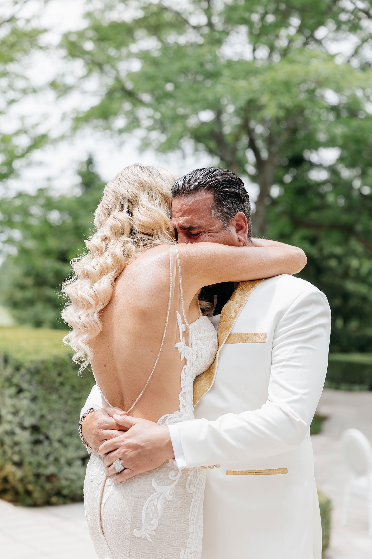Bride and groom photographed in an emotional embrace