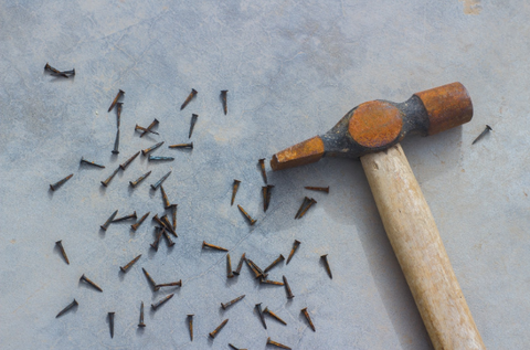 image of a hammer and nails - slim wallet