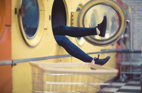 image of legs sticking out of a washing machine - slim wallet