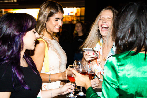 Image of girls drinking wine at our PON evente