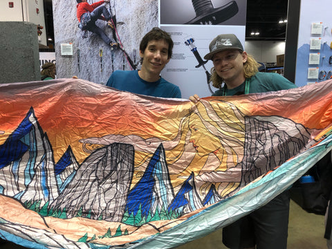 Adam Eggleston with Alex Honnold at Outdoor retailer 2019 Denver showing Madera Outdoor Company's new Art hammocks, A collaboration with Chris Benchetler and Skye Walker.