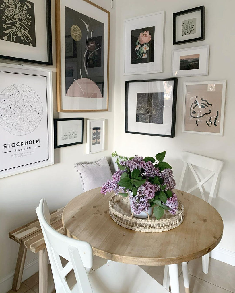 Beautiful kitchen table corner with an eclectic gallery wall