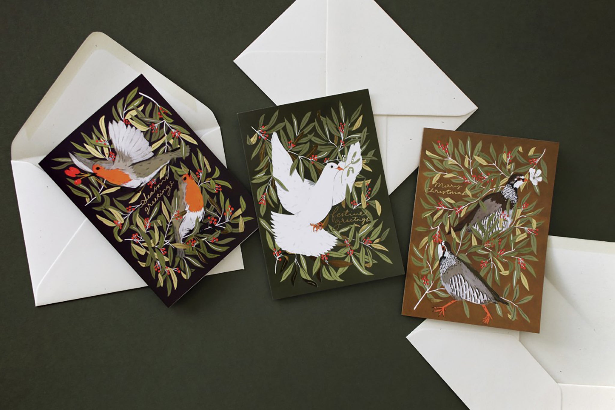 three illustrated Christmas cards with beautiful festive bird designs - robins, dove and partridges