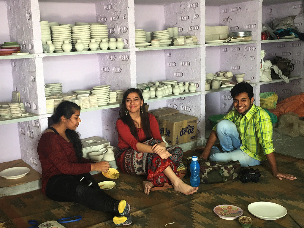students learning blue pottery design jaipur india, artisans and adventurers