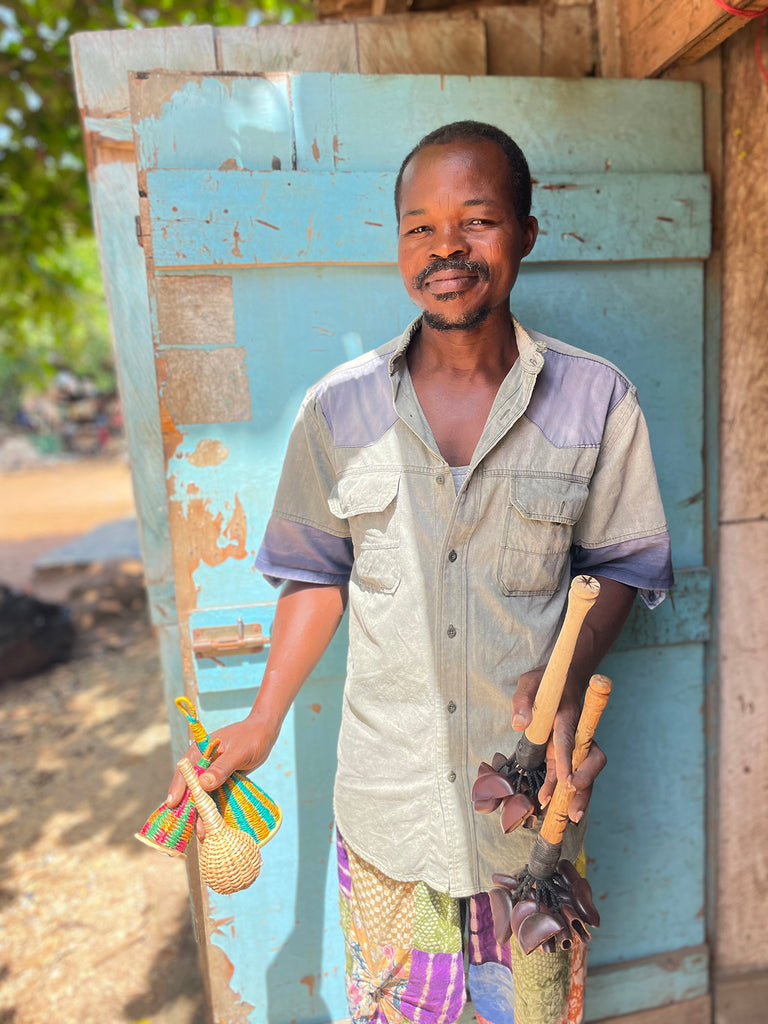 Artisan in Accra with musical shakers