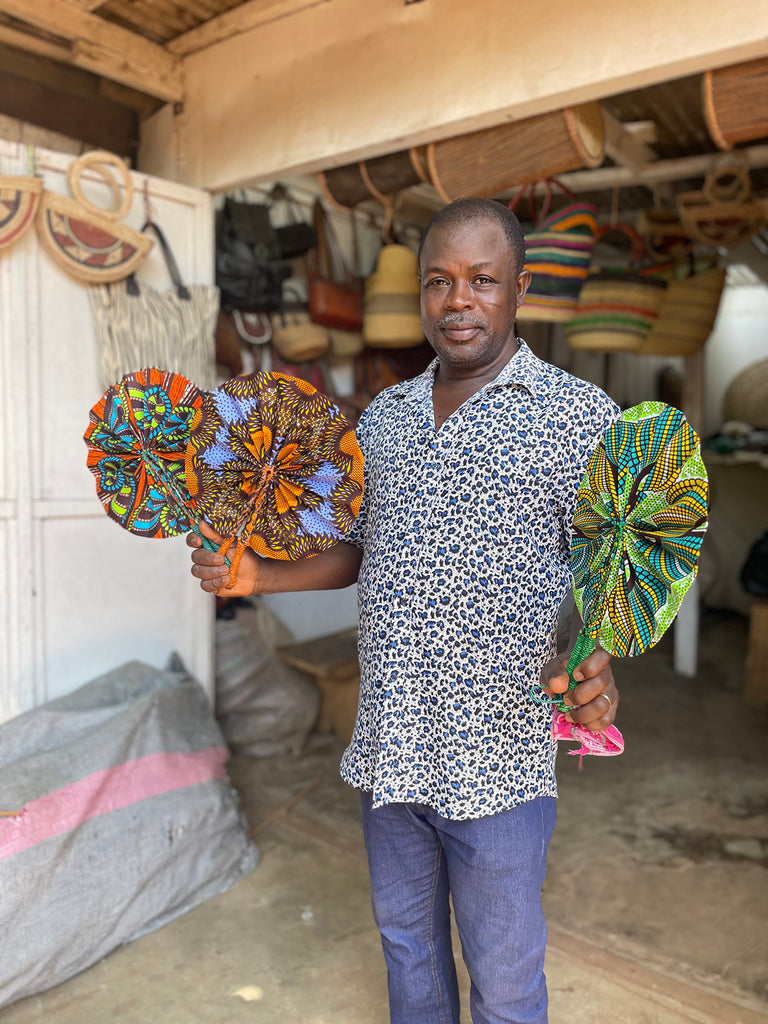 Ghanaian artisan Joseph with AARVEN fabric fans