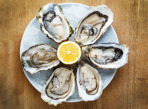 Oysters and lemon on plate - 5 Foods That Are Good For Your Nails