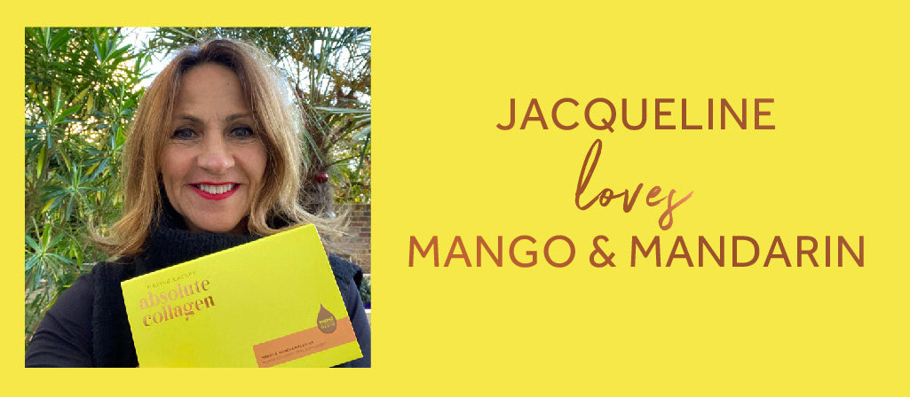 Photo on a yellow background showing a smiling white woman in her fifties with shoulder length brown hair, she is holding a box of Absolute Collagen Mango & Mandarin flavour