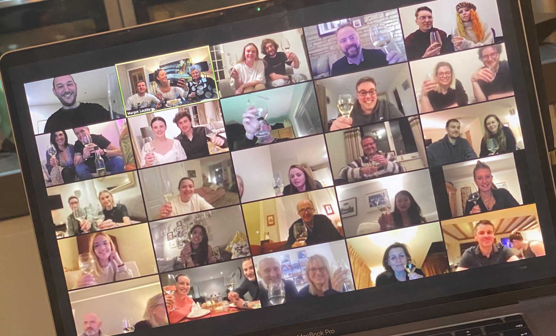 Photo of a laptop screen with the Absolute Collagen team enjoying wine and cheese on Zoom