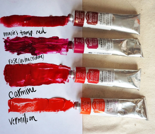 Four tubes of Master’s oil paint, in vermilion, carmine, rose and Marie’s transparent red, with streaks of paint from each tube spread out on a palette