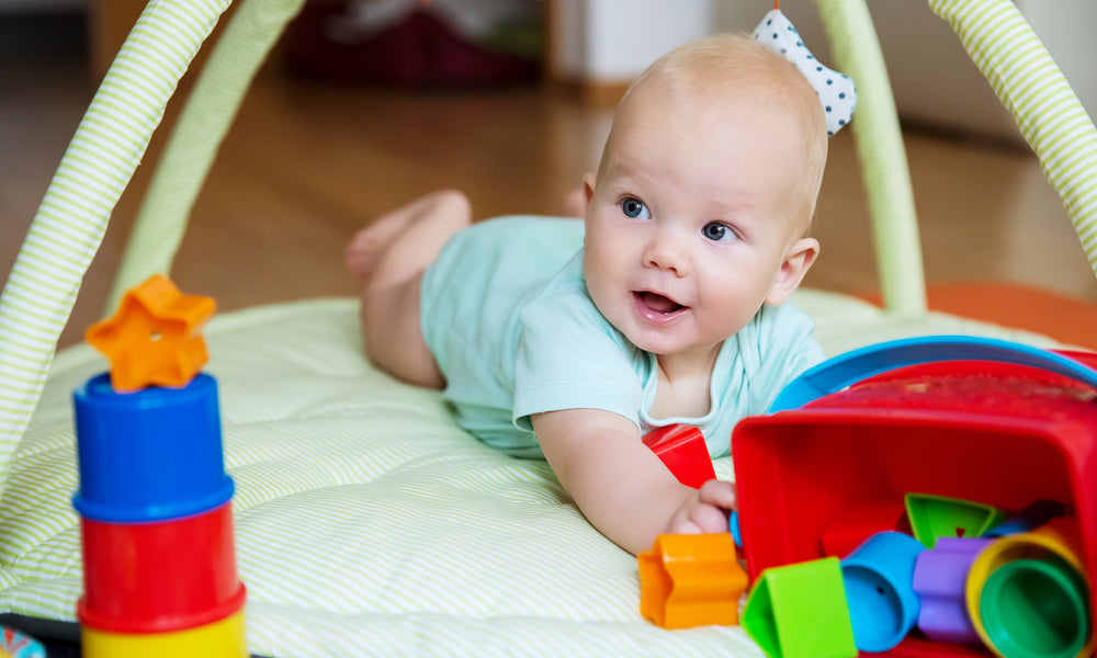 3 month old grabbing toys