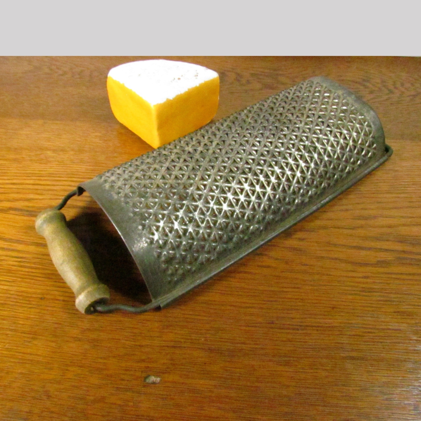 vintage round metal cheese grater