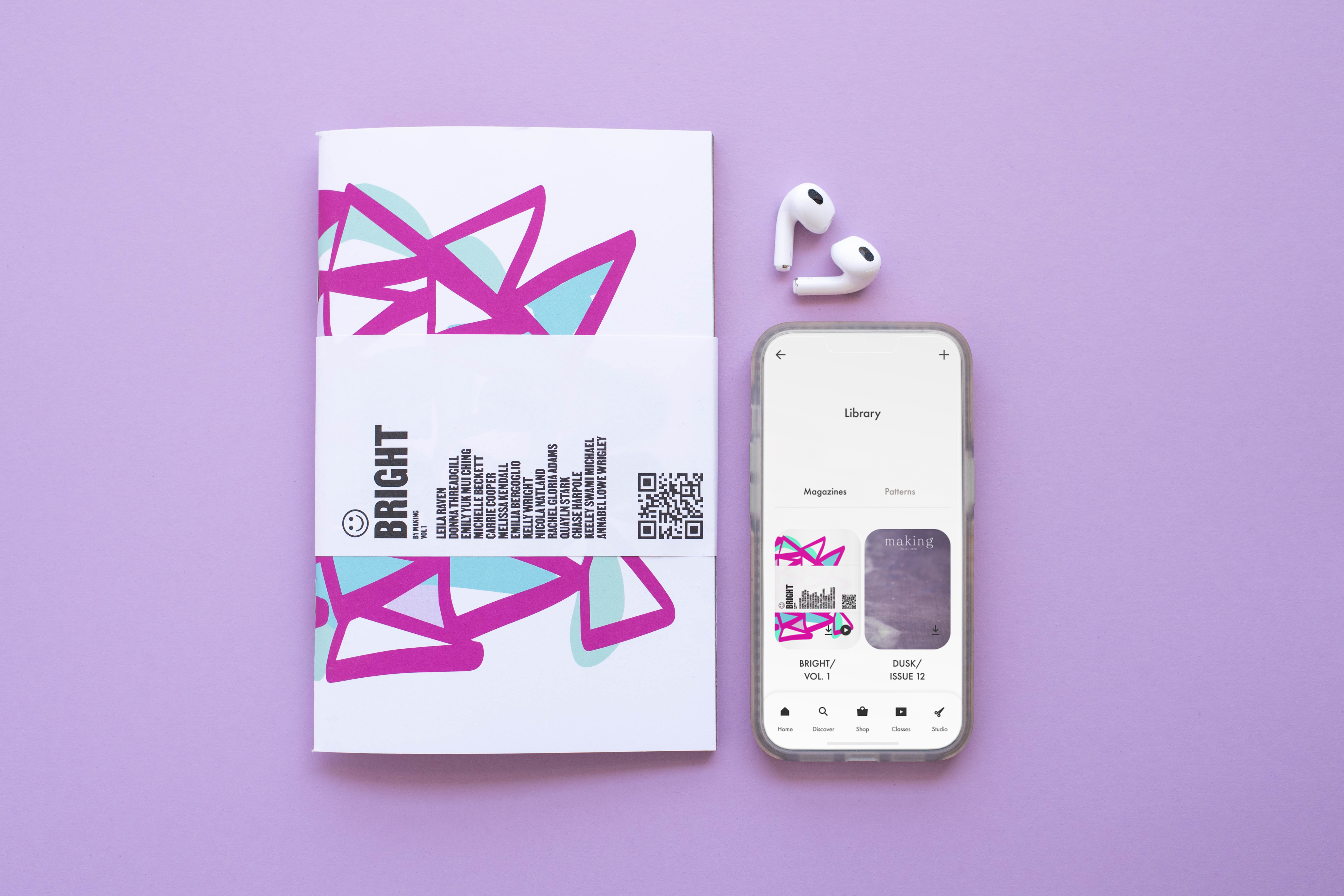 Bright Vol. 1 print magazine and digital issue shown on a phone with bluetooth headphones on a purple background.