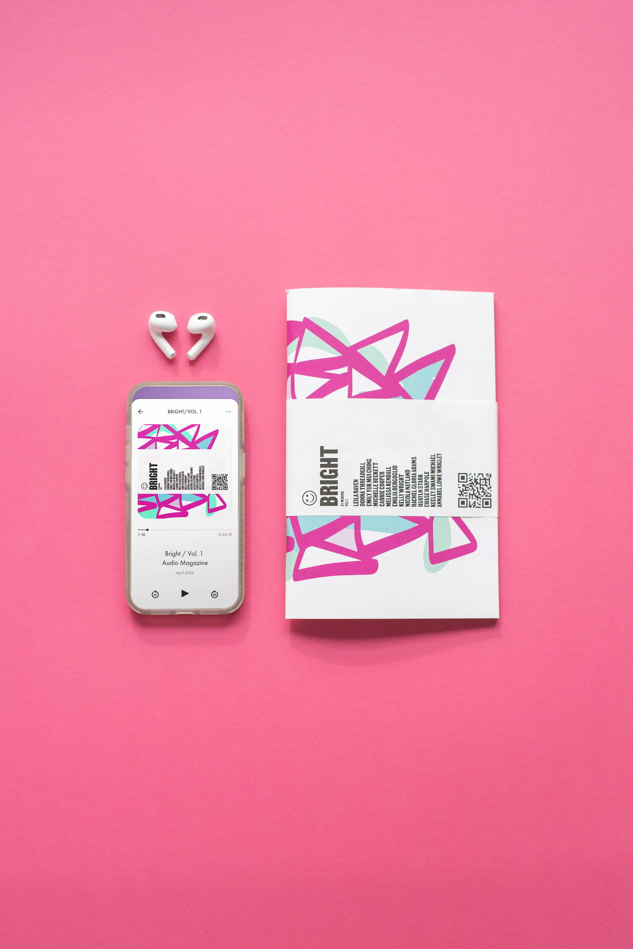 Bright Vol. 1 print magazine and digital issue shown on a phone with bluetooth headphones on a pink background