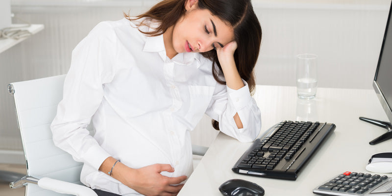 pregnant woman fatigued at work