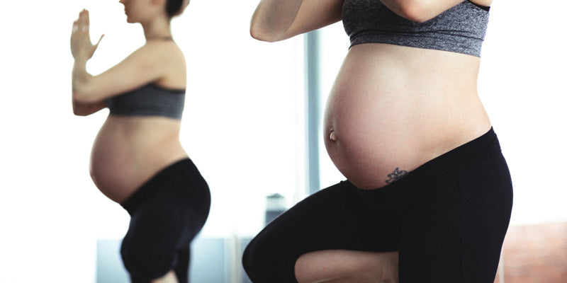 pregnant woman doing yoga