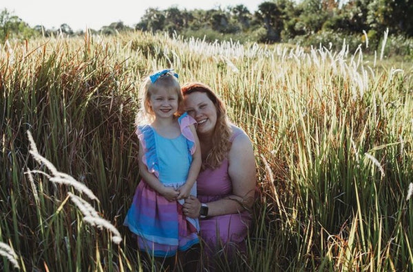 Mom with daughter in rainbow chiffon dress