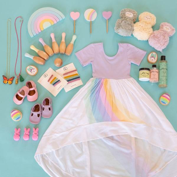 A flat lay of the pastel rainbow ballerina and the easter essentials