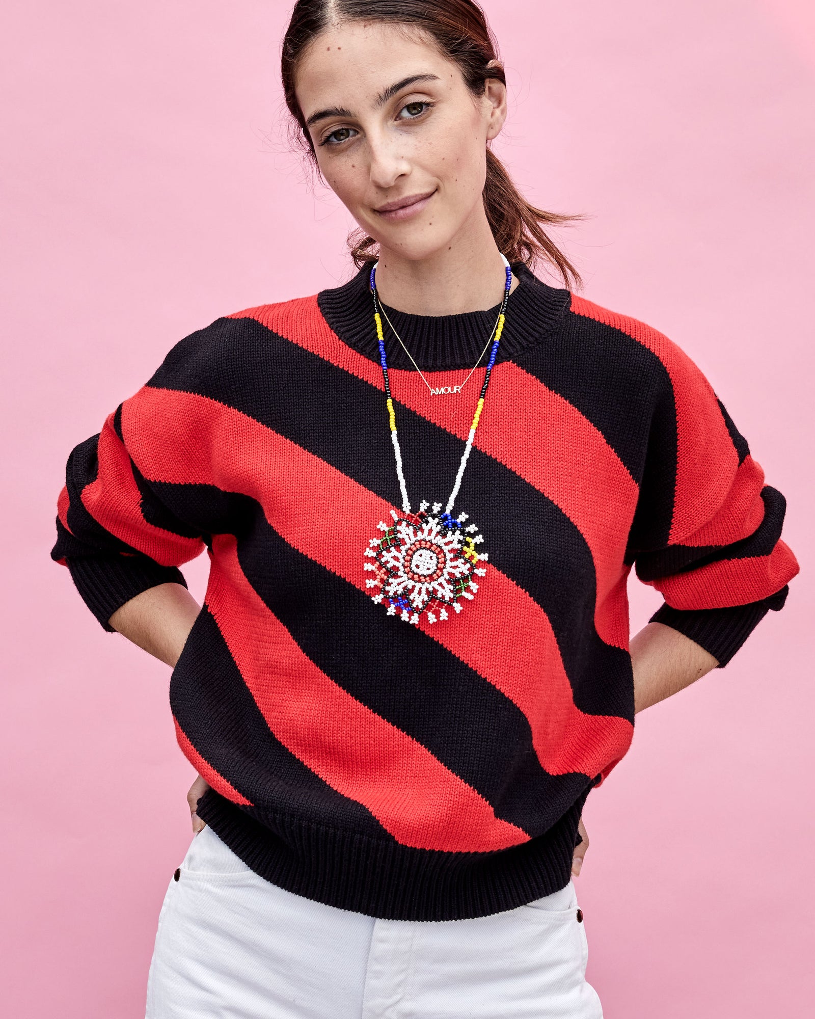 Frannie Wearing the Black & Poppy Diagonal Stripe Drop Shoulder Sweater 