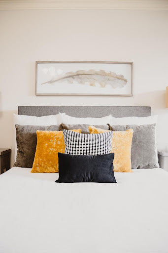 Finding the right-sized decorative cushions for your bed can really make a visual impact