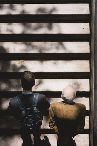 Accelerated aging men from too much sugar walking upstairs