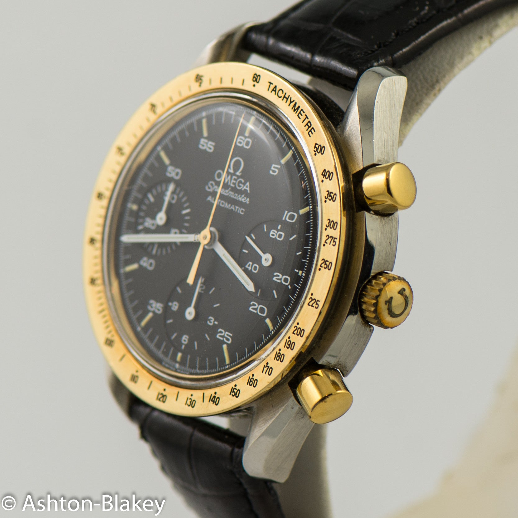 omega speedmaster gold bezel