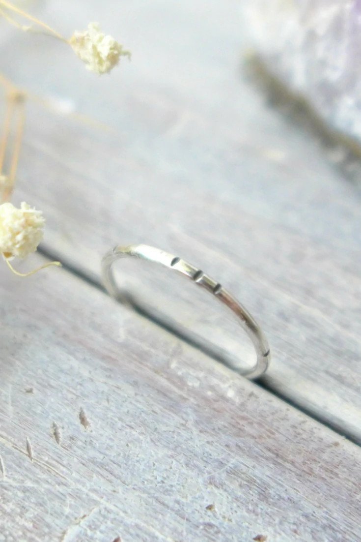 Closeup of a silver stacking ring.