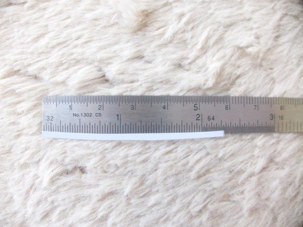 Measuring a strip of paper.