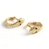 Snake huggies earrings in gold.