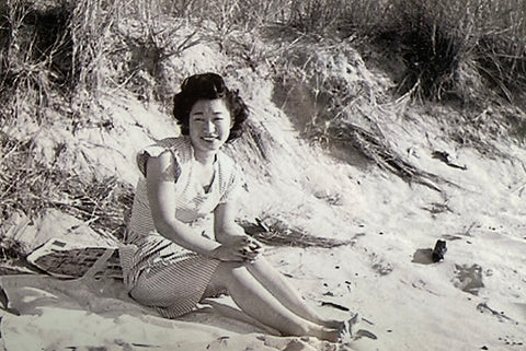 Black and white photo of beautiful Japanese woman sitting on the beach Helen Hisae M Hisae