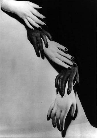 Horst P Horst black and white surrealist photo of overlapping and twisting black and white hands Newyork 1941.