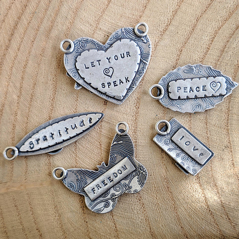 Sterling mantra pendants by Kristin Christopher